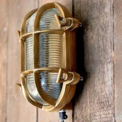Nkuku Oshi Brass Oval Outdoor Bulkhead Light - Brass Outdoor Lighting